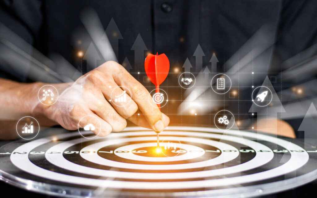 businessman throwing red arrow dart to target dart board. setup objectives and target for business investment concept. business investment objective concept marketing strategies and goals for success